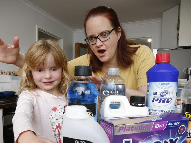 How parents keep their kids safe from household poisons like cleaners, detergents, medicines etc. Mum Emily Studd, stops her daughter Sophia 5 touching chemicals during cleaning the kitchen.                 Picture: David Caird