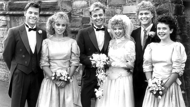 Began making music in Ramsay Street in 1987 ... Guy Pearce with Annie Jones, Jason Donovan, Kylie Minogue, Craig McLachlan and Sasha Close at the Scott and Charlene wedding.