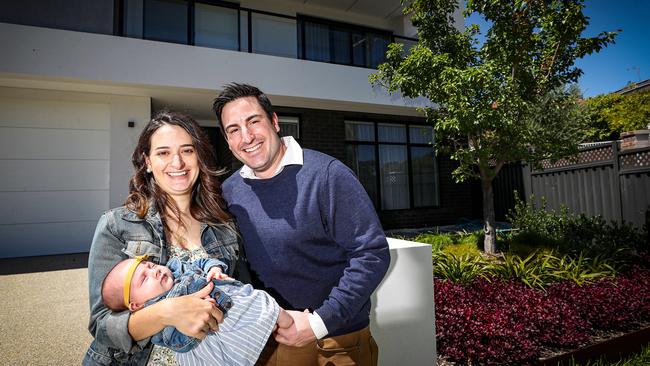 David and Stephanie Hampel with baby Vivienne in front of the house that they sold for more than $1m at Willetton, south of Perth. Picture: Colin Murty