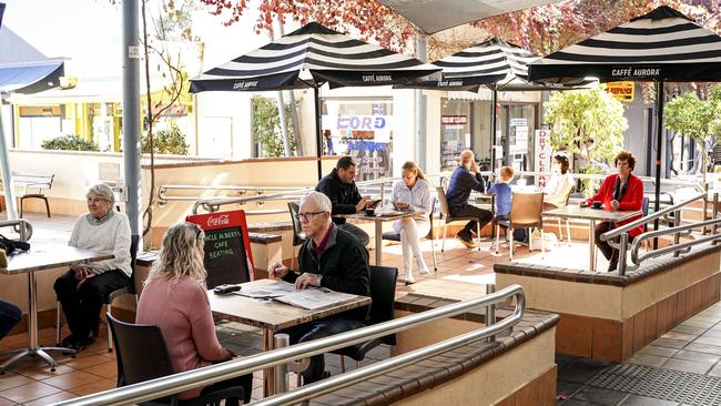 People enjoying outdoor areas in cafes along Norwood Parade, Cafe Buongiorno, Uncle Alberts Cafe on Monday. Picture: Mike Burton