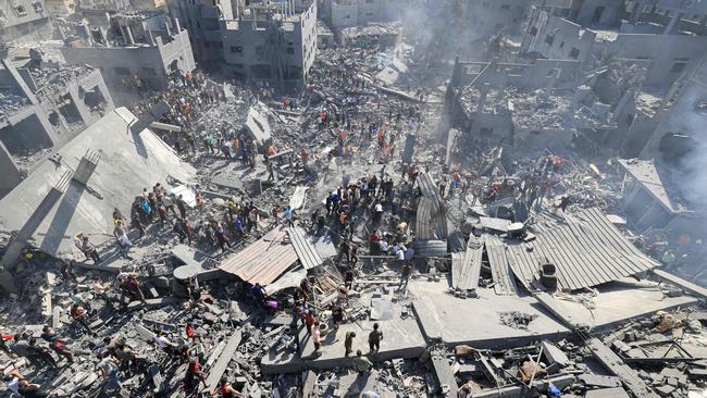 People search for survivors and the bodies of victims through the rubble of buildings destroyed during Israeli bombardment, in Khan Yunis in the southern Gaza Strip. Picture: AFP