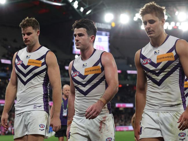 Fremantle leave the field in defeat. (Photo by James Wiltshire/AFL Photos via Getty Images)