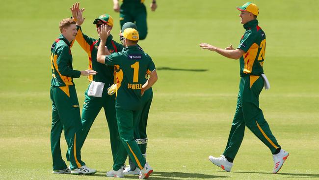 Tom Andrews of Tasmania and teammates celebrate the dismissal of Matt Short of Victoria during the Marsh One Day Cup match between Victoria and Tasmania at CitiPower Centre on March 10, 2021 in Melbourne, Australia. (Photo by Kelly Defina/Getty Images)