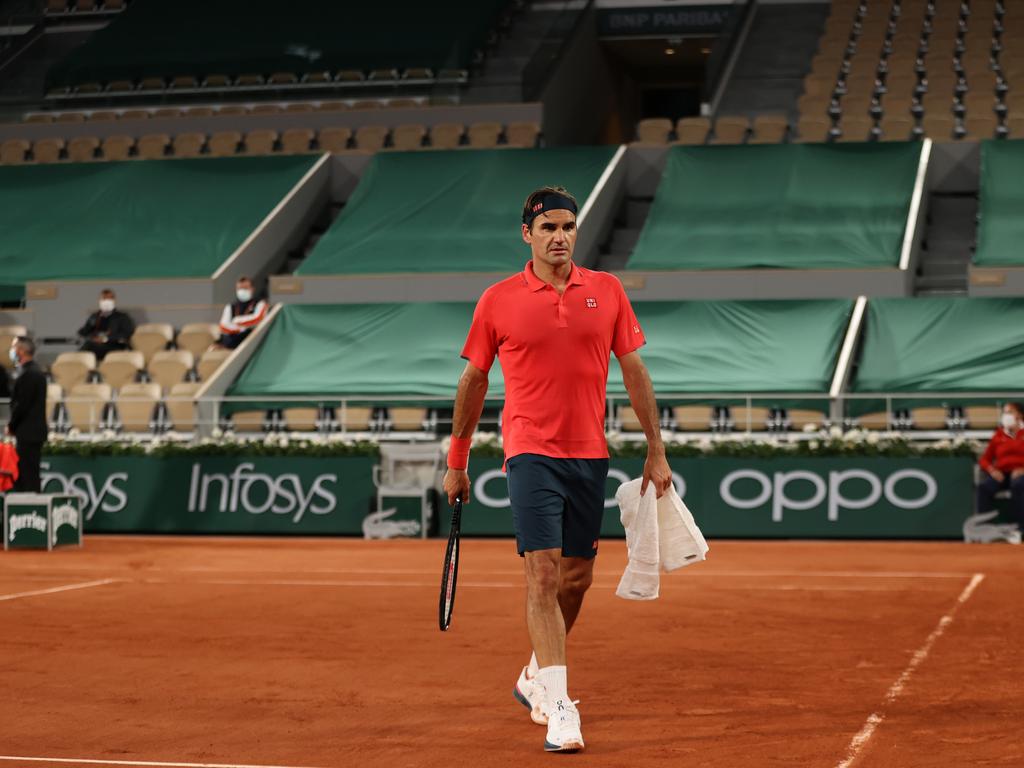 Roger Federer in front of the empty stands on Philippe Chatrier centre court.