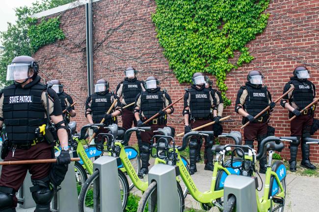 State Patrol Police officers block a road in Minneapolis. Picture: AFP