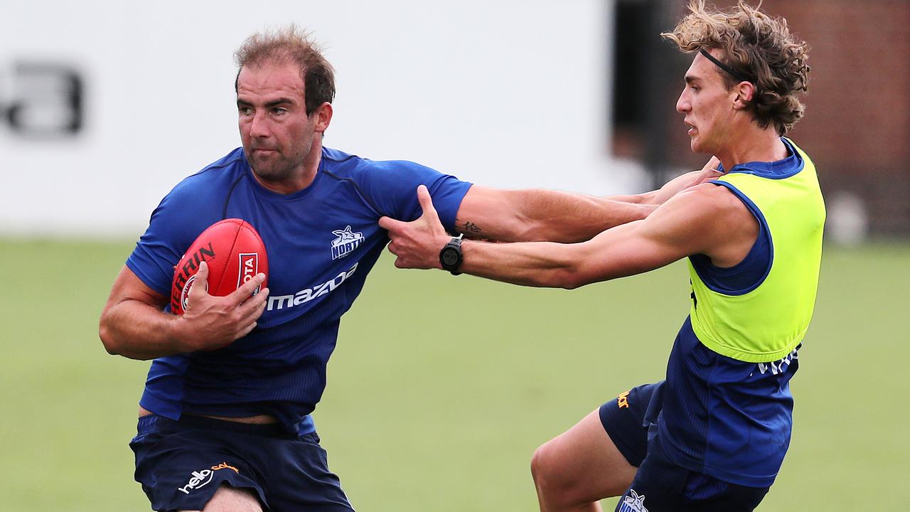 Roos fans will be keen to see more Ben Cunnington fend offs in 2021 after injury kept him out for much of last year. Picture: Michael Klein