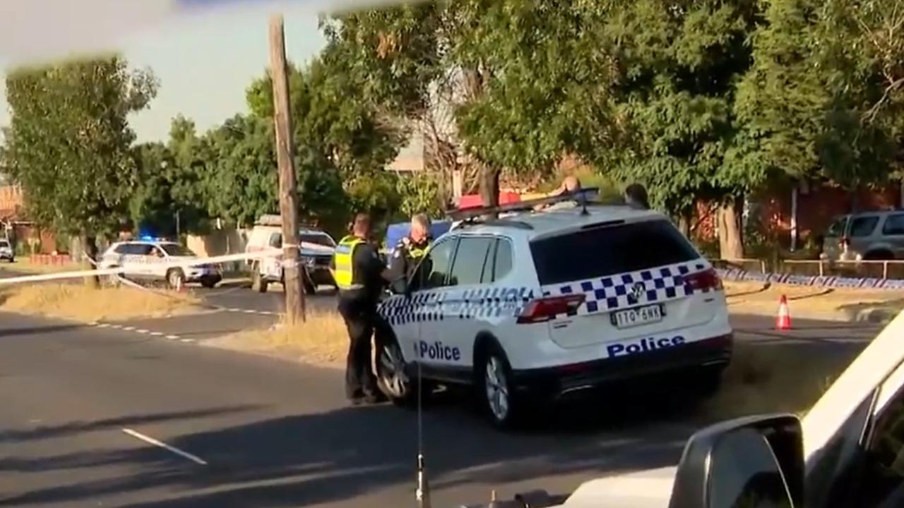 Dozens of police are on the scene, with the road taped off and closed in both directions momentarily. Picture: 9News