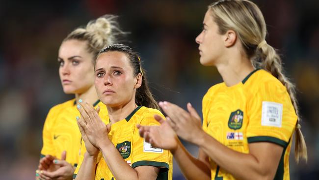 SYDNEY, AUSTRALIA - AUGUST 16: Hayley Raso (C) and Australia players applaud fans after the team's 1-3 defeat and elimination from the tournament following the FIFA Women's World Cup Australia & New Zealand 2023 Semi Final match between Australia and England at Stadium Australia on August 16, 2023 in Sydney, Australia. (Photo by Brendon Thorne/Getty Images)