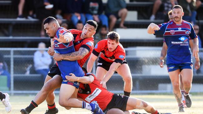 Ormeau, Queensland, OrmeauÃ&#149;s Andrew Petaia is dragged down by the Mudgeeraba defence during action from the Queensland Rugby League Qtop A-Grade match of the round between Ormeau and Mudgeeraba, played at Ormeau. Photo: Scott Powick Newscorp