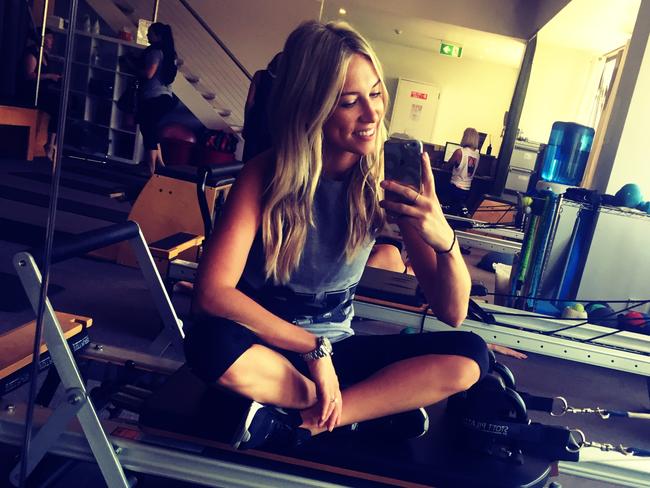 Phoebe loving life in the reformer pilates studio. Picture: Phoebe Burgess.