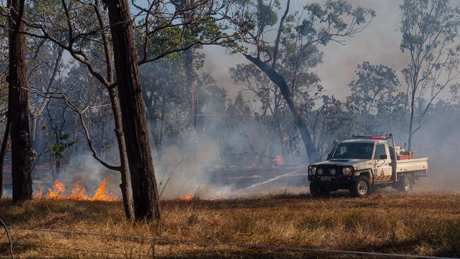 A bushfire ripped through the Livingstone area this afternoon, threatening local properties. Picture: Che Chorley