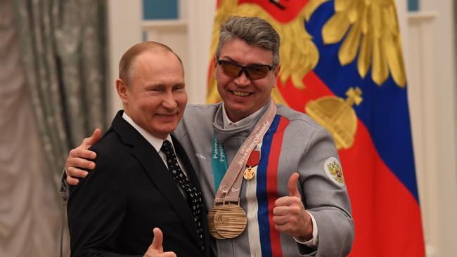 Russian President Vladimir Putin poses with Valery Redkozubov, medal winner at the 2018 Pyeongchang Winter Paralympic Games. Picture: AFP