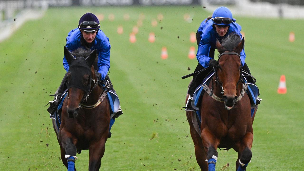 Jamie Kah riding Traffic Warden (left) in gallop at Flemington with stablemate Spacewalk this week. Picture: Vince Caligiuri/Getty Images