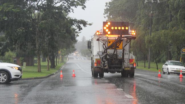 Flooding on Bray St, Coffs Harbour on Wednesday March 18. Cars unwilling to take a 1 minute and 47 second detour drive through floodwaters on Bray St after Council closed the road. Coffs Harbour floods.