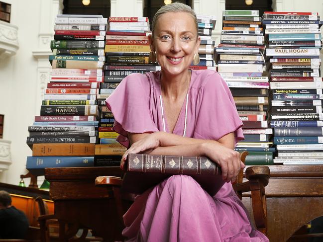 State Library VictoriaÃs 165th birthday this Thursday 11 February. State Library CEO Kate Torney with 165 books from the shelves of the Dome Reading Room.                   Picture: David Caird