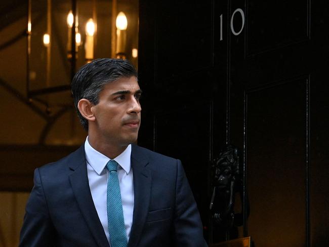 TOPSHOT - Britain's Prime Minister Rishi Sunak leaves 10 Downing Street in central London on October 26, 2022, for the House of Commons to take part in his first Prime Minister's Questions (PMQs). - Rishi Sunak will today face off against opposition lawmakers for the first time as British prime minister, in a likely raucous parliamentary session following weeks of political turmoil. (Photo by JUSTIN TALLIS / AFP)