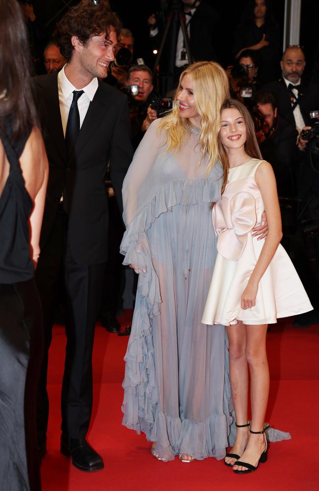 Sienna Miller, centre, with Oli Green and her daughter, Marlowe Sturridge. Picture: Getty Images