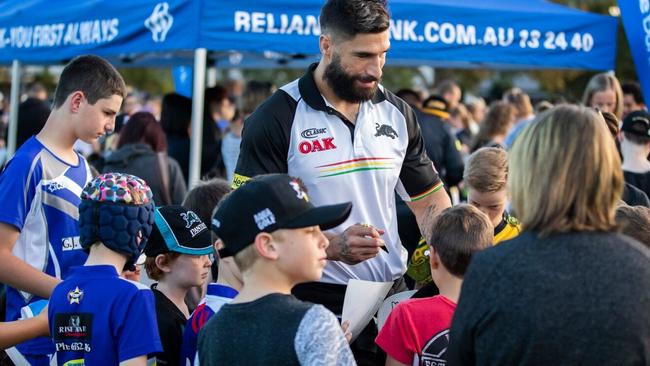 Penrith’s James Tamou meets locals at a coaching clinic in Bathurst.