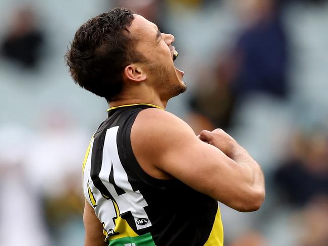 Sydney Stack of the Tigers celebrates a goal during the Round 17 AFL match between the Richmond Tigers and the GWS Giants at the MCG in Melbourne, Sunday, July 14, 2019.  (AAP Image/Mark Dadswell) NO ARCHIVING, EDITORIAL USE ONLY