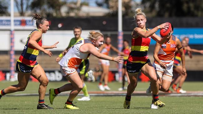 ADELAIDE, AUSTRALIA - MARCH 15: Erin Phillips of the Crows evades Tait Mackrill of the Giants during the 2020 AFLW Round 06 match between the Adelaide Crows and the GWS Giants at Hisense Stadium on March 15, 2020 in Adelaide, Australia. (Photo by Matt Turner/AFL Photos via Getty Images)