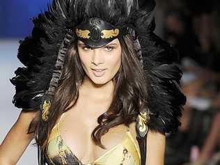 BIRDS OF A FEATHER: A model takes to the catwalk during Rosemount Fashion Week in Sydney wearing one of Terry Cronin’s feather headdresses.