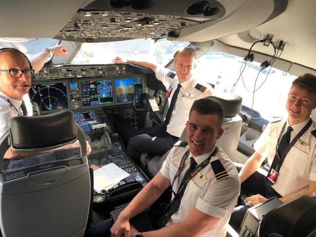 The crew on the first of eight repatriation flights to bring Aussies home.