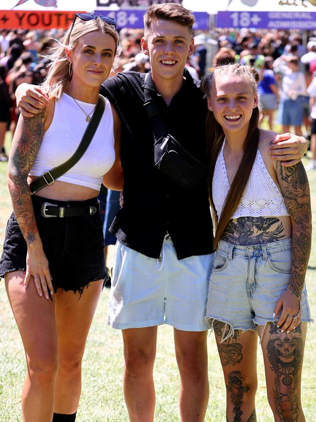 Michael Paul (centre) with Yasmin (left) and Kian (right) followed the shorts theme of the day. Picture: NCA NewsWire / Kelly Barnes