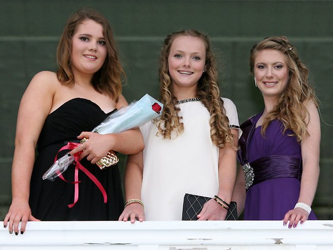 From left, Meredith McKenzie, Bridget Foale and Caitlin Stalker at the MacKillop Catholic College school formal at Tattersalls Park. Picture: Carolyn Docking