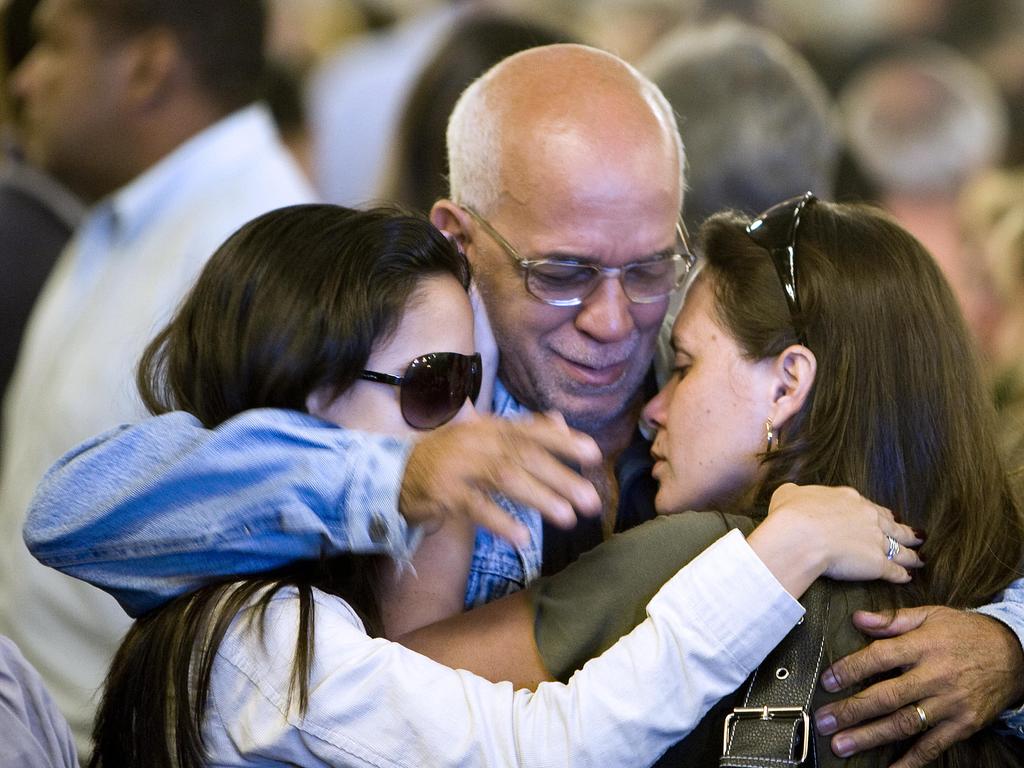 Friends and relatives of the Air France flight 447 passengers comfort each other after attending a mass in their homage in 2009.