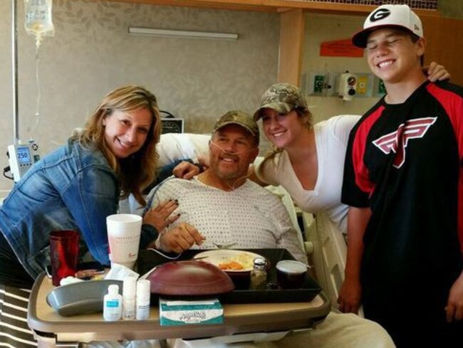 Family man ... Mr Sain recovering in hospital surrounded by his family. Picture: Facebook/Jennifer Sain
