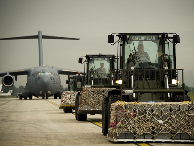 Crates of military stores are loaded onto a Royal Australian Air Force C-17 Globemaster at Tirana Airport, Albania.