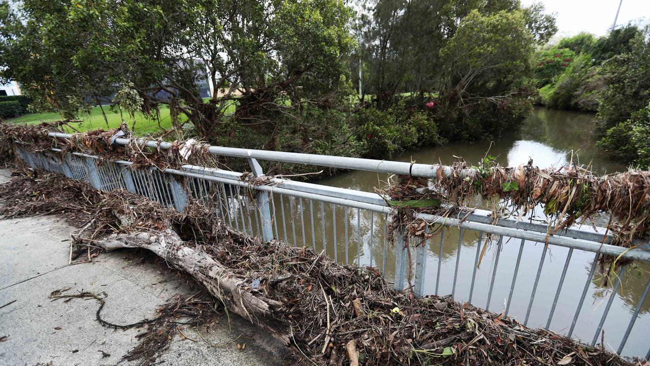 Flood Water clean up on the Gold Coast. Saltwater Creek on Siganto Drive, Helensvale burst its banks. Picture: NIGEL HALLETT