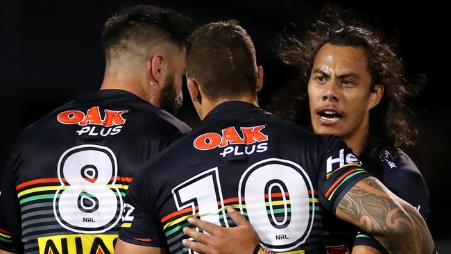 James Fisher-Harris and Jarome Luai of the Panthers celebrate a try against the Titans. Picture: Getty Images