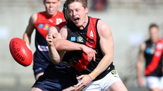 North Hobart’s Nathan McCulloch tackles North Launceston’s Mark Walsh. Picture: NIKKI DAVIS-JONES