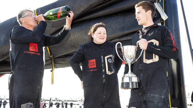 Samantha Grant, centre, celebrates with husband Jim Cooney and son James. Picture: Richard Jupe