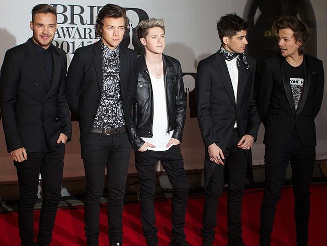 Liam Payne, Harry Styles, Niall Horan, Zayn Malik and Louis Tomlinson of British-Irish pop band One Direction pose on the red carpet.