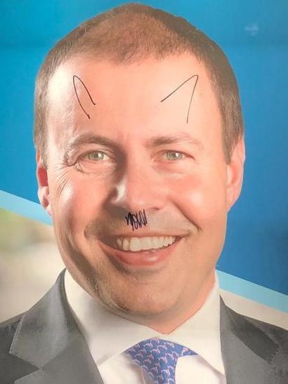 Another Frydenberg poster vandalised with a Hitler moustache.