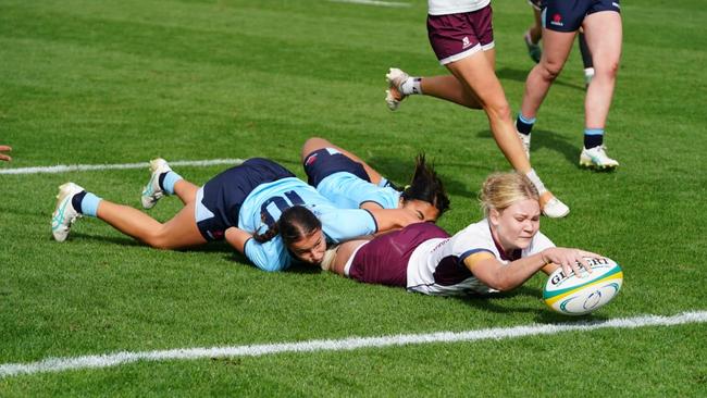 QLD White under 16s captain Poppy Gibbons reaches out to score at the 2024 Australian Schools Rugby Championships. Picture: Anthony Edgar.