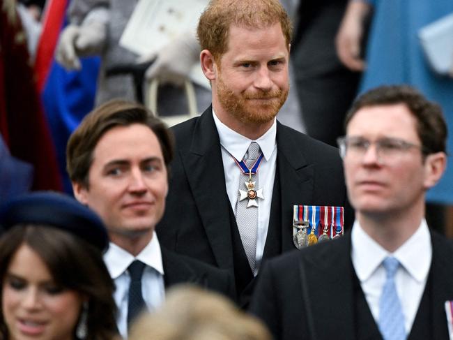 Prince Harry was relegated to hanging out with his cousins’ husbands, Jack Brooksbank and Edoardo Mapelli Mozzi. Picture: AFP