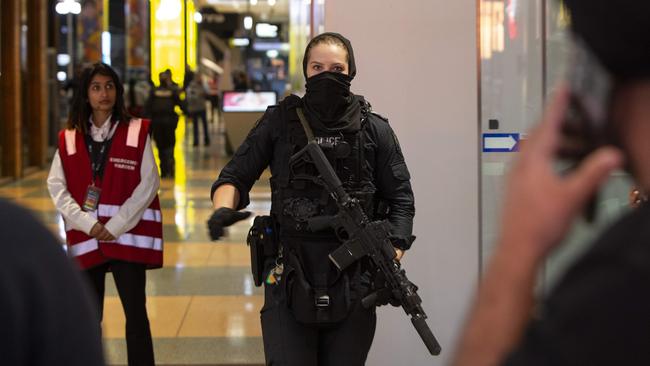 Heavily armed police swarmed into the centre. Picture: Brett Hartwig