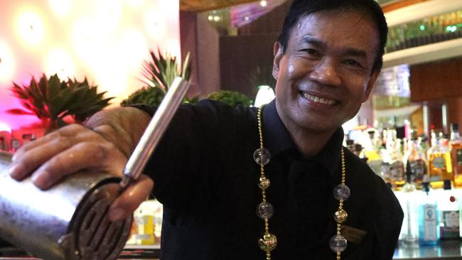 Pullman Reef Casino bar supervisor Eddie Valdez prepares festive cocktails ahead of the venues New Year’s Eve celebrations on Tuesday night. Photo: Catherine Duffy.