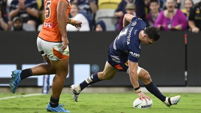 Scott Drinkwater of the Cowboys scores a try during the round 18 NRL match between North Queensland Cowboys and Wests Tigers at Qld Country Bank Stadium on July 01, 2023 in Townsville, Australia. (Photo by Ian Hitchcock/Getty Images)