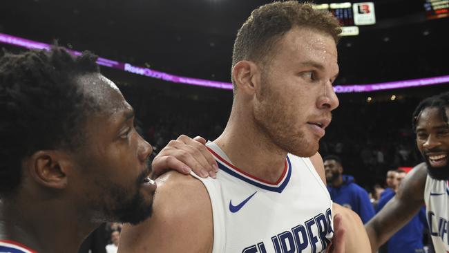 Los Angeles Clippers forward Blake Griffin is mobbed by teammates.