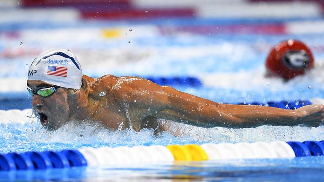 Michael Phelps storms to victory in the 200m butterfly at the US swimming trials.