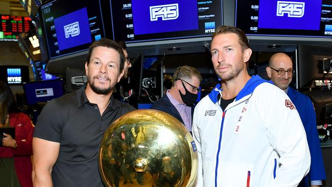 Mark Wahlberg and F45 Founder and CEO Adam Gilchrist on the trading floor as F45 Training rings the opening bell at the New York Stock Exchange back in 2021. Picture: Getty