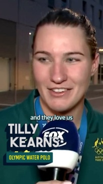 Tilly and Phil Kearns after Australia shock the US in water polo shootout