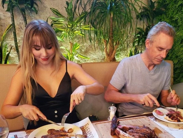 Mikhaila Peterson eating a steak with her world famous father and psychologist Jordan.