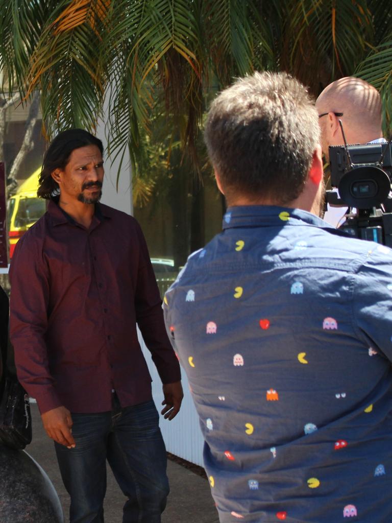 Garth Spain speaks with his lawyer outside the Darwin Local Court on Wednesday. Picture: Jason Walls