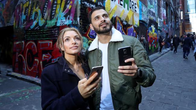 13/05/2018: Android phone users Christine Serhan (28) & Aneeq Choudhry (28) taking in the sights of Hosier Lane in Melbourne. Stuart McEvoy for The Australian.