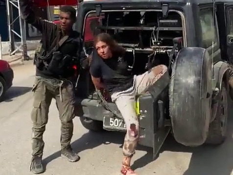 A still taken from video appearing on social media purportedly showing an Israeli hostage taken prisoner by Palestinian militants.